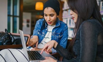 Two women discussing business ideas