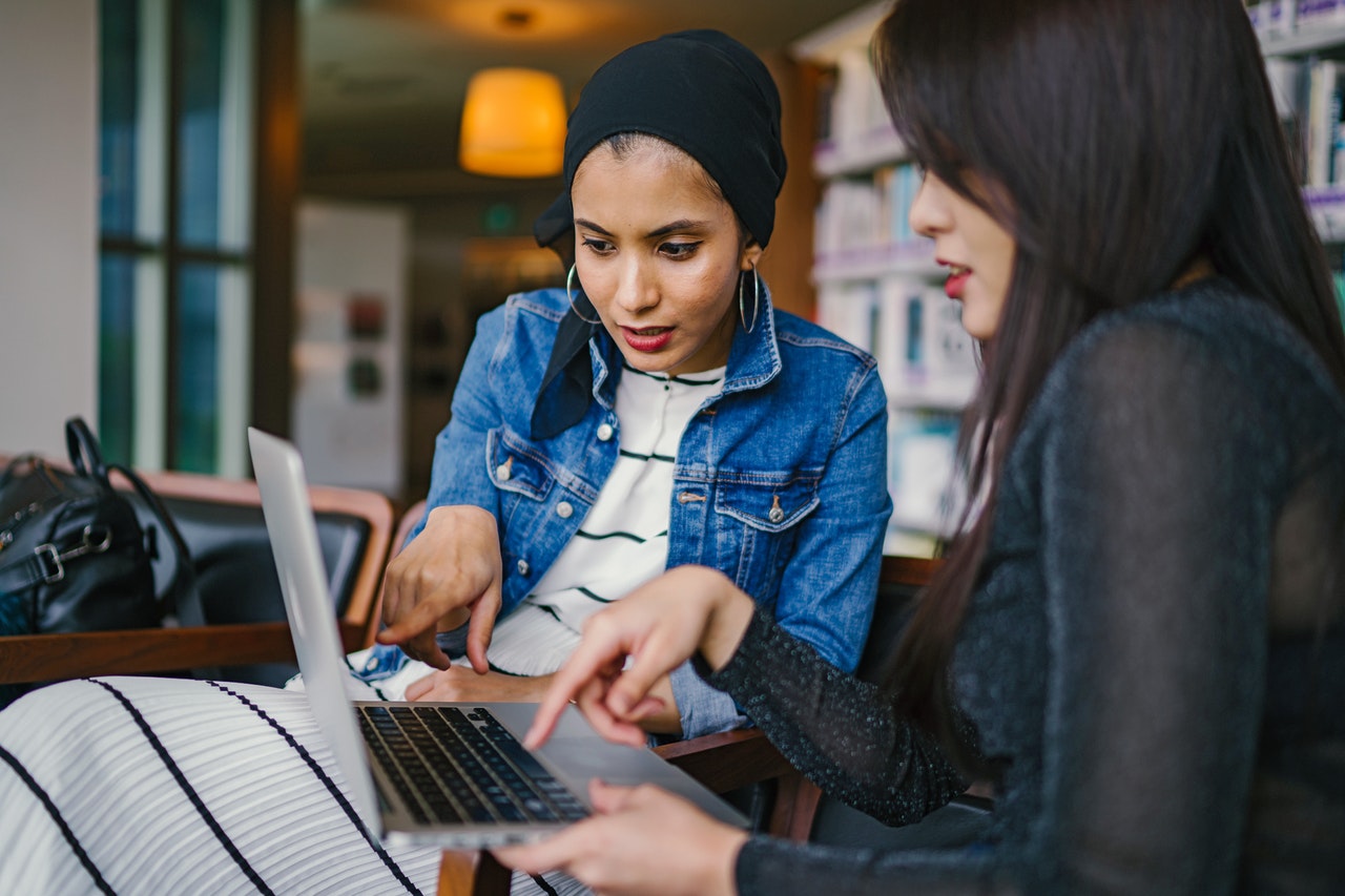 Two women discussing business ideas